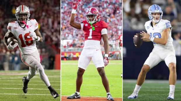 Marvin Harrison Jr. runs with the ball in one arm; Kool-Aid McKinstry puts one finger up standing in the endzone (center); Drake Maye holds the football